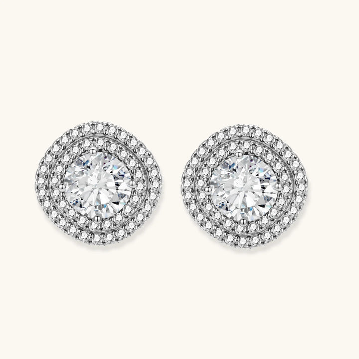 Double halo sterling silver stud earrings with brilliant round moissanite center stones and pavé crystal accents