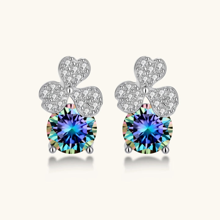 Sterling silver stud earrings with four-leaf clover design featuring small crystals above round moissanite stones