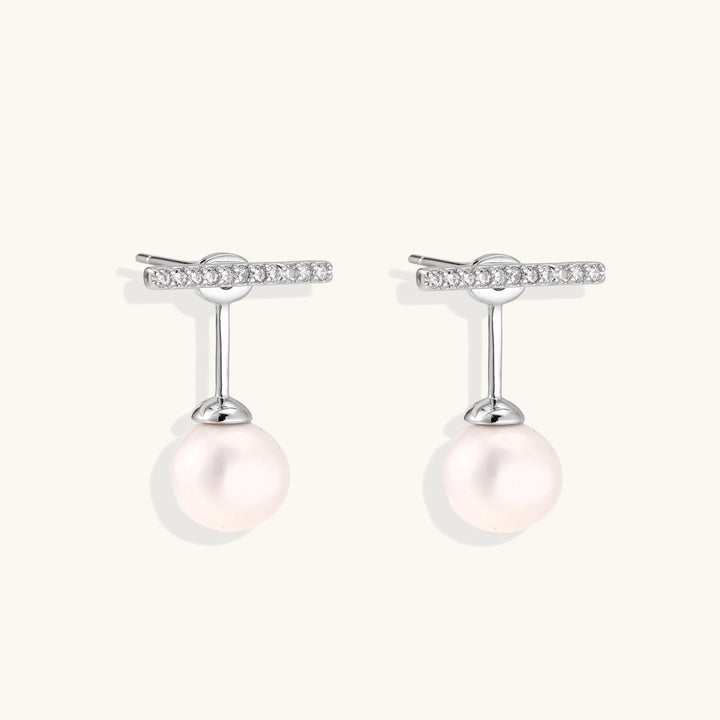 Rhodium-plated sterling silver ear jacket earrings with diamond-set horizontal bar and freshwater pearl drop