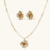 14K gold-plated flower jewelry set with zirconia crystals, featuring dimensional petal necklace and matching earrings